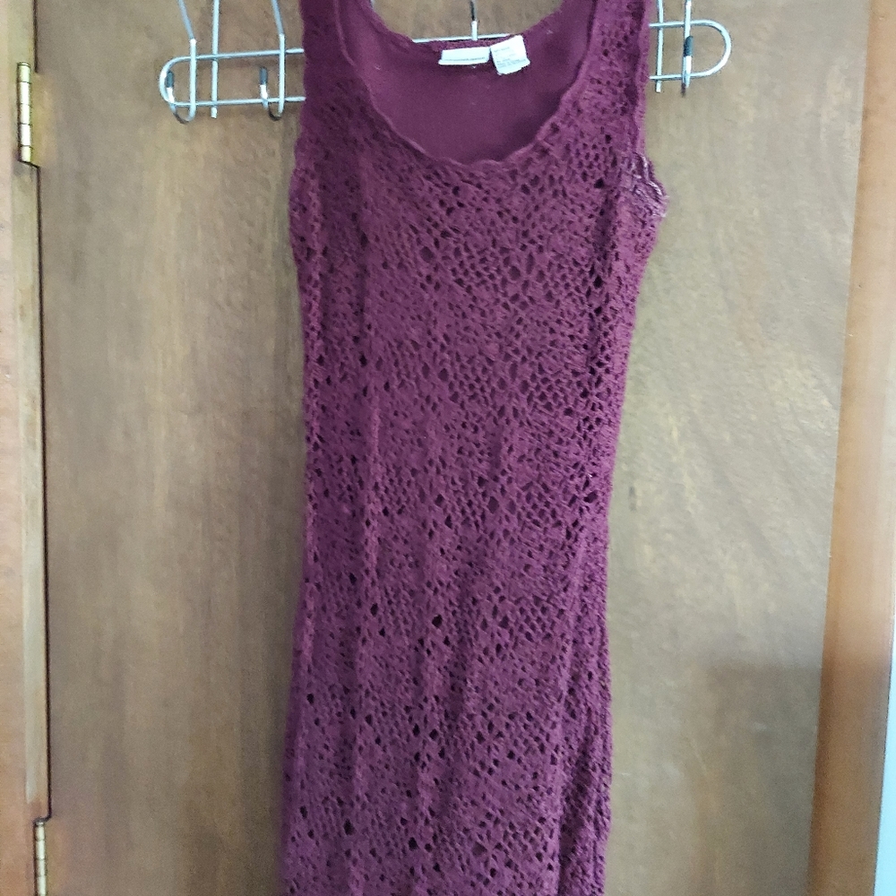 Long burgundy crocheted sleeveless dress.